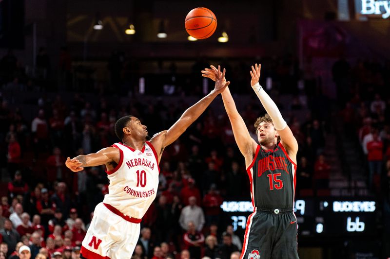 Jan 23, 2024; Lincoln, Nebraska, USA; Ohio State Buckeyes guard Bowen Hardman (15) shoots a 3-point shot against Nebraska Cornhuskers guard Jamarques Lawrence (10) during the second half at Pinnacle Bank Arena. Mandatory Credit: Dylan Widger-USA TODAY Sports