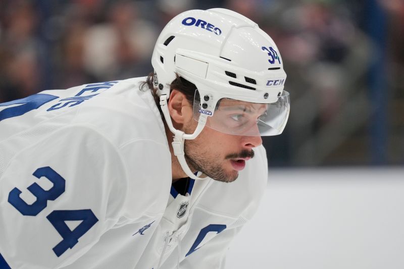 Oct 22, 2024; Columbus, Ohio, USA; Toronto Maple Leafs center Auston Matthews (34) awaits the faceoff during the first period against the Columbus Blue Jackets at Nationwide Arena. Mandatory Credit: Aaron Doster-Imagn Images