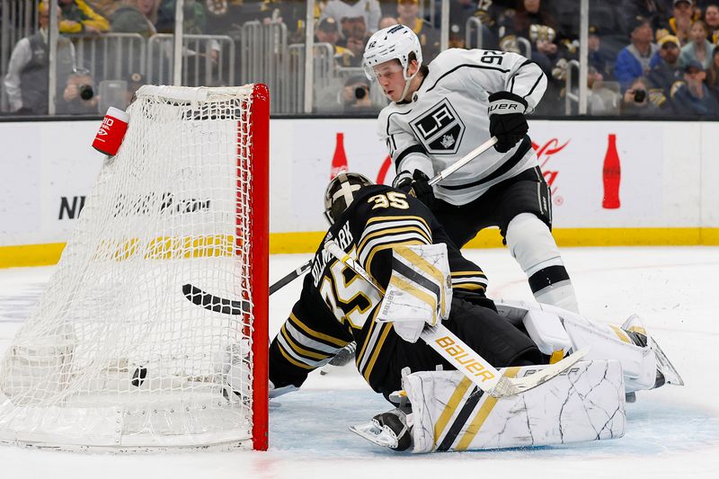 Feb 17, 2024; Boston, Massachusetts, USA; Los Angeles Kings defenseman Brandt Clarke (92) scores on Boston Bruins goaltender Linus Ullmark (35) in overtime to defeat the Boston Bruins 5-4 at TD Garden. Mandatory Credit: Winslow Townson-USA TODAY Sports