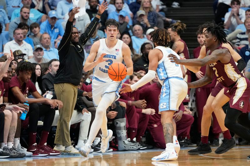 Dec 2, 2023; Chapel Hill, North Carolina, USA;  North Carolina Tar Heels guard RJ Davis (4) poses to guard Cormac Ryan (3) in the first half at Dean E. Smith Center. Mandatory Credit: Bob Donnan-USA TODAY Sports