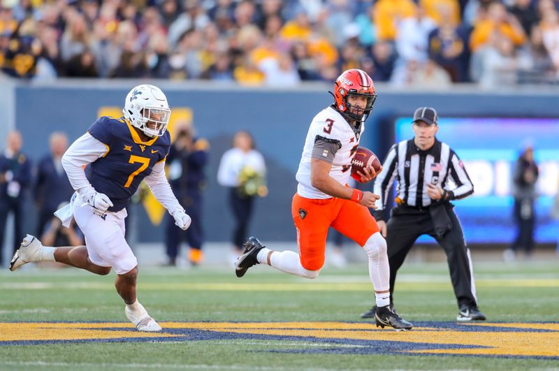 Nov 6, 2021; Morgantown, West Virginia, USA; Oklahoma State Cowboys quarterback Spencer Sanders (3) runs out of the pocket during the second quarter against the West Virginia Mountaineers at Mountaineer Field at Milan Puskar Stadium. Mandatory Credit: Ben Queen-USA TODAY Sports