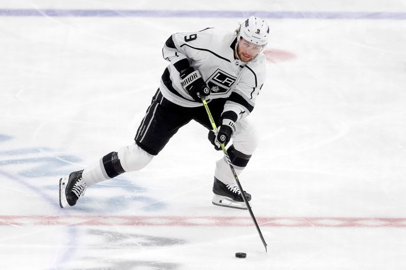 Feb 18, 2024; Pittsburgh, Pennsylvania, USA;  Los Angeles Kings right wing Adrian Kempe (9) skates up ice with the puck against the Pittsburgh Penguins during the second period at PPG Paints Arena. Los Angeles won 2-1. Mandatory Credit: Charles LeClaire-USA TODAY Sports