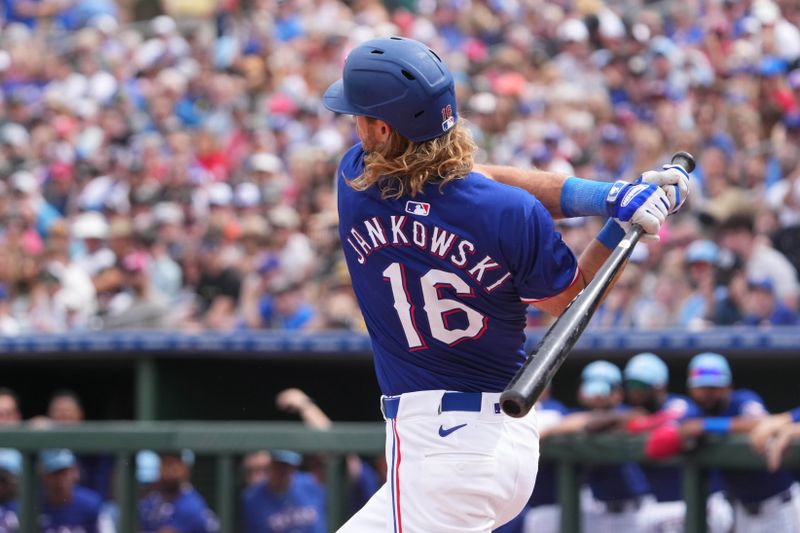 Mar 12, 2024; Surprise, Arizona, USA; Texas Rangers left fielder Travis Jankowski (16) bats against the Cleveland Guardians during the first inning at Surprise Stadium. Mandatory Credit: Joe Camporeale-USA TODAY Sports