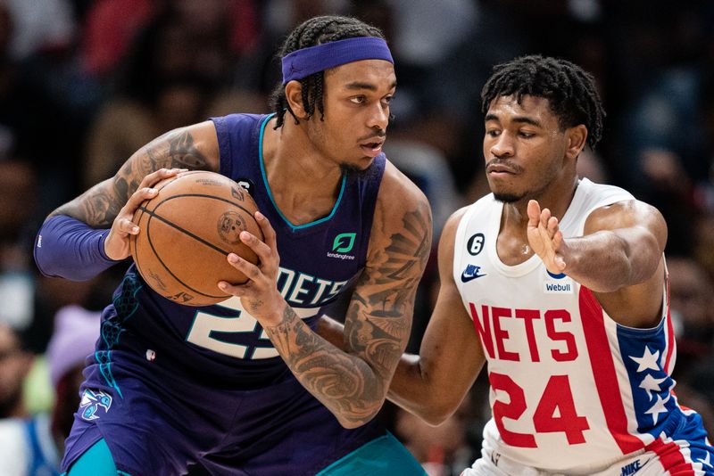 CHARLOTTE, NORTH CAROLINA - NOVEMBER 05: Cam Thomas #24 of the Brooklyn Nets guards P.J. Washington #25 of the Charlotte Hornets in the fourth quarter during their game at Spectrum Center on November 05, 2022 in Charlotte, North Carolina. NOTE TO USER: User expressly acknowledges and agrees that, by downloading and or using this photograph, User is consenting to the terms and conditions of the Getty Images License Agreement. (Photo by Jacob Kupferman/Getty Images)