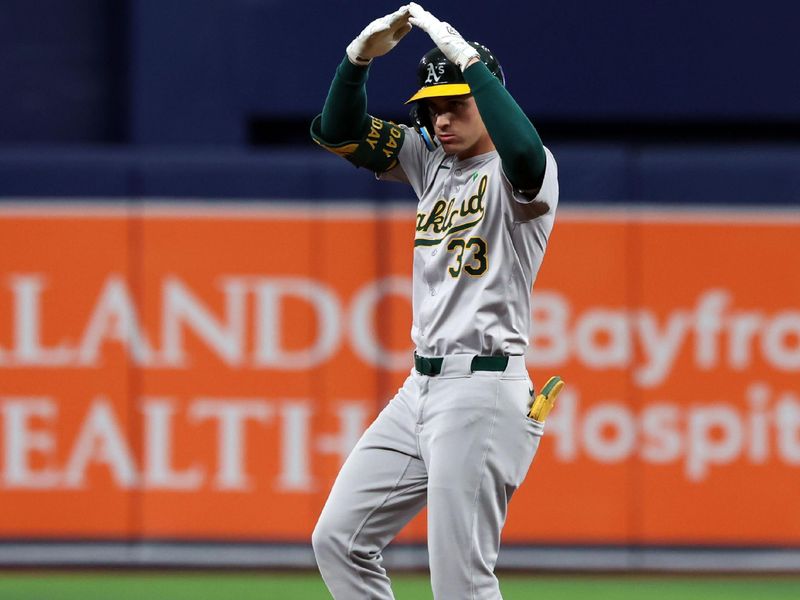 May 30, 2024; St. Petersburg, Florida, USA; Oakland Athletics outfielder JJ Bleday (33) celebrates to the dugout after he doubles against the Tampa Bay Rays during the tenth inning at Tropicana Field. Mandatory Credit: Kim Klement Neitzel-USA TODAY Sports