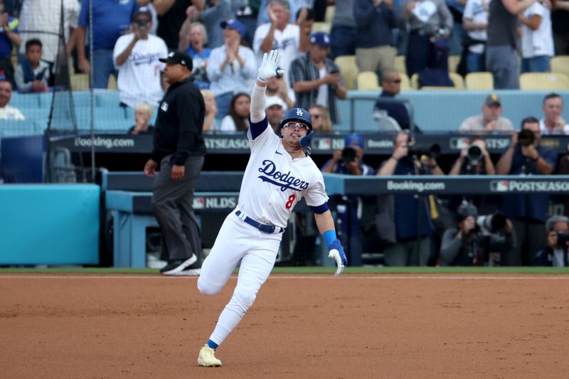 Oct 11, 2024; Los Angeles, California, USA; Los Angeles Dodgers third baseman Enrique Hernandez (8) runs after hitting a solo home run in the second inning against the San Diego Padres during game five of the NLDS for the 2024 MLB Playoffs at Dodger Stadium. Mandatory Credit: Kiyoshi Mio-Imagn Images