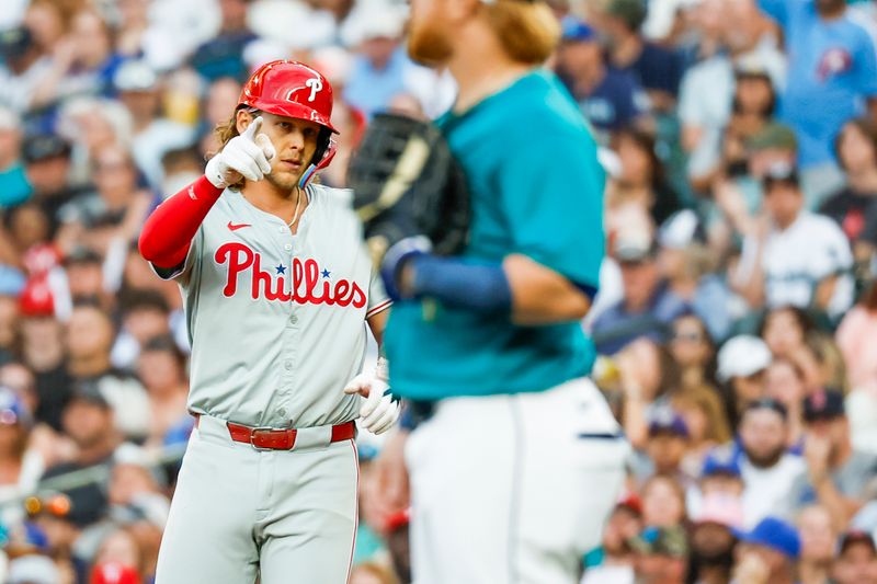 Aug 3, 2024; Seattle, Washington, USA; Philadelphia Phillies third baseman Alec Bohm (28) celebrates towards the dugout after hitting a two-run single against the Seattle Mariners during the fifth inning at T-Mobile Park. Mandatory Credit: Joe Nicholson-USA TODAY Sports