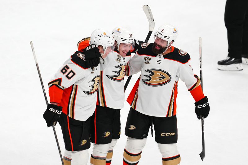 Apr 18, 2024; Las Vegas, Nevada, USA; Anaheim Ducks right wing Frank Vatrano (77) celebrates with defenseman Jackson LaCombe (60) and defenseman Radko Gudas (7) after scoring a third goal against the Vegas Golden Knights during the third period at T-Mobile Arena. Mandatory Credit: Stephen R. Sylvanie-USA TODAY Sports