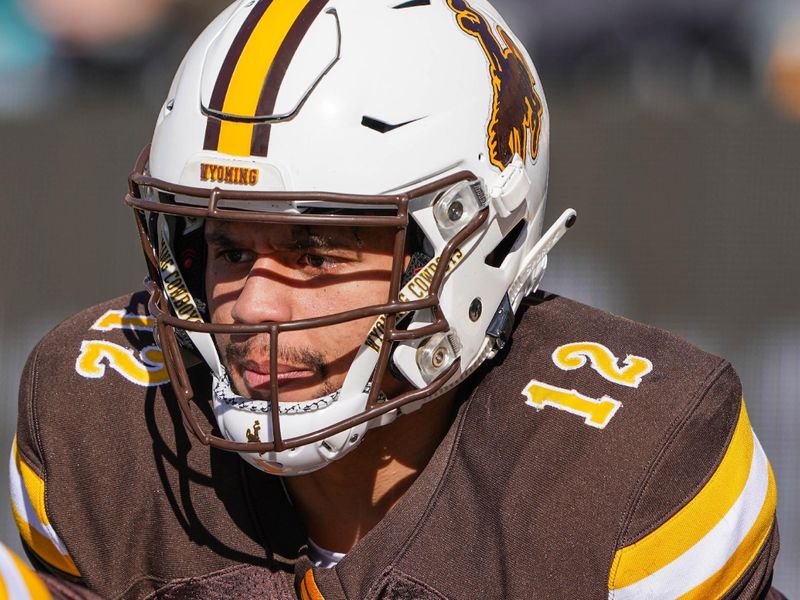 Oct 26, 2019; Laramie, WY, USA; Wyoming Cowboys quarterback Sean Chambers (12) warms up before game against the Nevada Wolf Pack at Jonah Field War Memorial Stadium. Mandatory Credit: Troy Babbitt-USA TODAY Sports