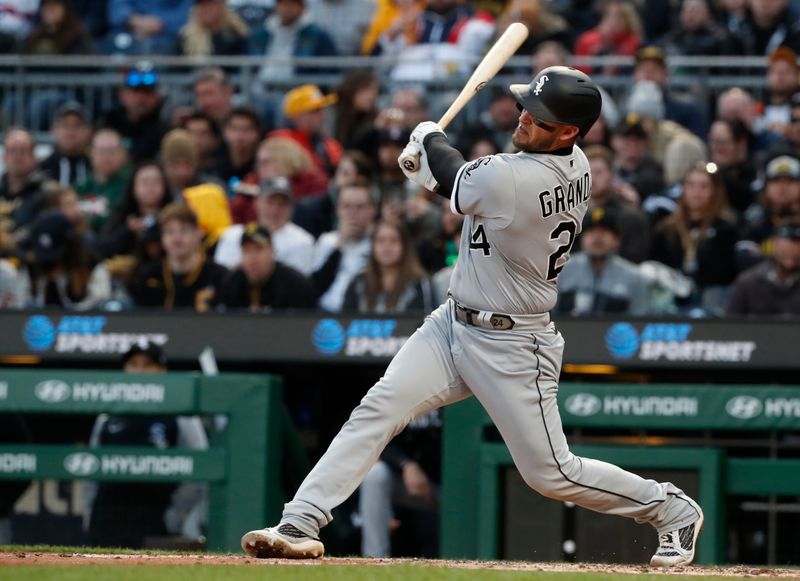 Apr 8, 2023; Pittsburgh, Pennsylvania, USA;  Chicago White Sox catcher Yasmani Grandal (24) hits a two-run single against the Pittsburgh Pirates during the third inning at PNC Park. Mandatory Credit: Charles LeClaire-USA TODAY Sports