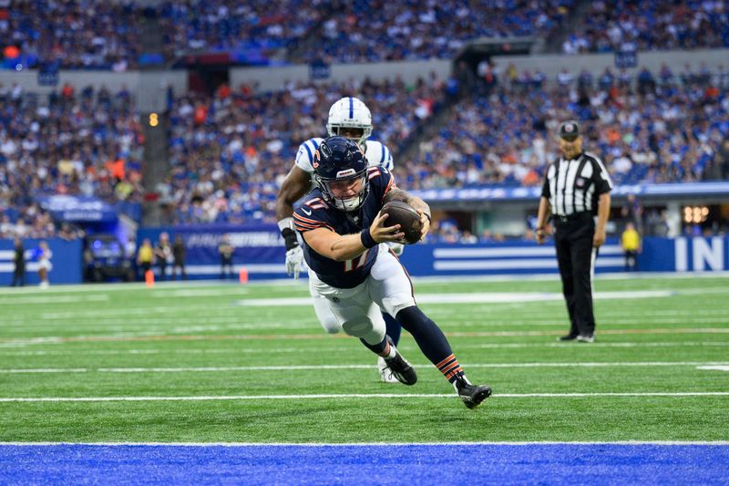 Chicago Bears quarterback Tyson Bagent (17) dives into the end zone for a touchdown during an NFL football game against the Indianapolis Colts, Saturday, Aug. 19, 2023, in Indianapolis. (AP Photo/Zach Bolinger)