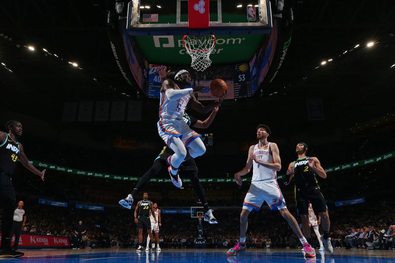 OKLAHOMA CITY, OK - MARCH 12: Luguentz Dort #5 of the Oklahoma City Thunder drives to the basket during the game against the Indiana Pacers on March 12, 2024 at Paycom Arena in Oklahoma City, Oklahoma. NOTE TO USER: User expressly acknowledges and agrees that, by downloading and or using this photograph, User is consenting to the terms and conditions of the Getty Images License Agreement. Mandatory Copyright Notice: Copyright 2024 NBAE (Photo by Zach Beeker/NBAE via Getty Images)