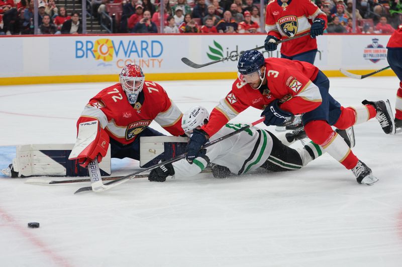 Nov 1, 2025; Sunrise, Florida, USA; Florida Panthers defenseman Seth Jones (3) dives for the puck against Dallas Stars center Sam Steel (18) as Florida Panthers goaltender Sergei Bobrovsky (72) defends his net during the third period at Amerant Bank Arena. Mandatory Credit: Sam Navarro-Imagn Images