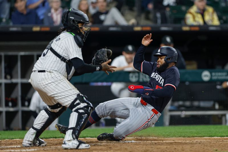 Apr 30, 2024; Chicago, Illinois, USA; Minnesota Twins outfielder Manuel Margot (13) scores against the Chicago White Sox during the eight inning at Guaranteed Rate Field. Mandatory Credit: Kamil Krzaczynski-USA TODAY Sports