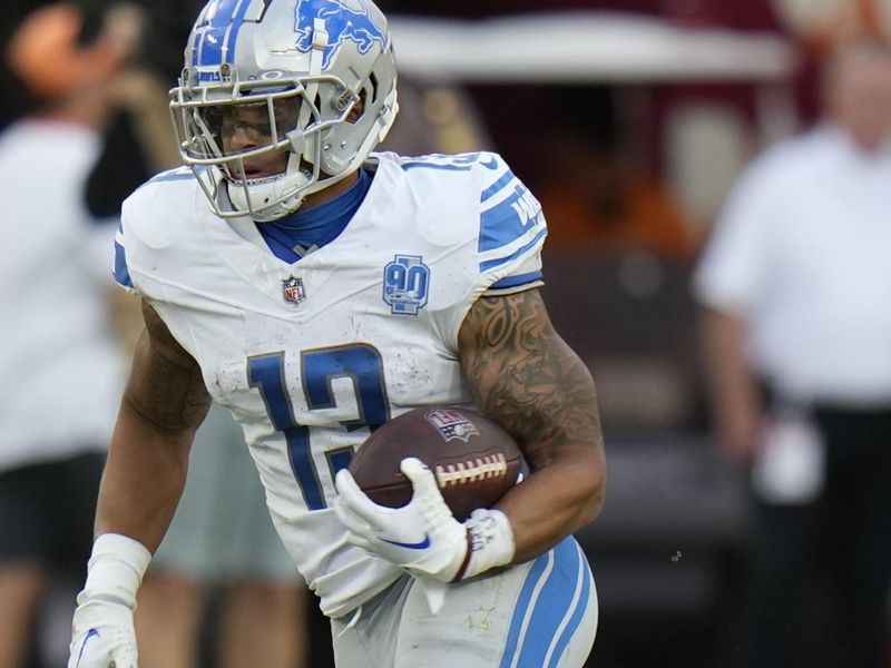 Detroit Lions running back Craig Reynolds rushes against the Tampa Bay Buccaneers during the second half of an NFL football game Sunday, Oct. 15, 2023, in Tampa, Fla. (AP Photo/Chris O'Meara)