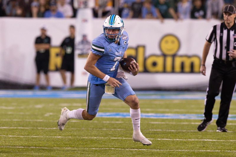 Dec 3, 2022; New Orleans, Louisiana, USA; Tulane Green Wave quarterback Michael Pratt (7) scrambles against the UCF Knights during the second half at Yulman Stadium. Mandatory Credit: Stephen Lew-USA TODAY Sports