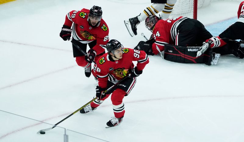 Oct 24, 2023; Chicago, Illinois, USA; Chicago Blackhawks center Connor Bedard (98) clears the defensive zone during the second period against the Boston Bruins at United Center. Mandatory Credit: David Banks-USA TODAY Sports