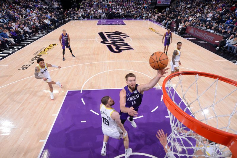 SACRAMENTO, CA - DECEMBER 8: Domantas Sabonis #11 of the Sacramento Kings drives to the basket during the game against the Utah Jazz on December 8, 2024 at Golden 1 Center in Sacramento, California. NOTE TO USER: User expressly acknowledges and agrees that, by downloading and or using this Photograph, user is consenting to the terms and conditions of the Getty Images License Agreement. Mandatory Copyright Notice: Copyright 2024 NBAE (Photo by Rocky Widner/NBAE via Getty Images)