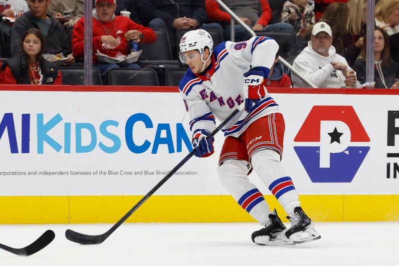 Oct 17, 2024; Detroit, Michigan, USA;  New York Rangers defenseman Victor Mancini (90) skates with the puck in the first period against the Detroit Red Wings at Little Caesars Arena. Mandatory Credit: Rick Osentoski-Imagn Images