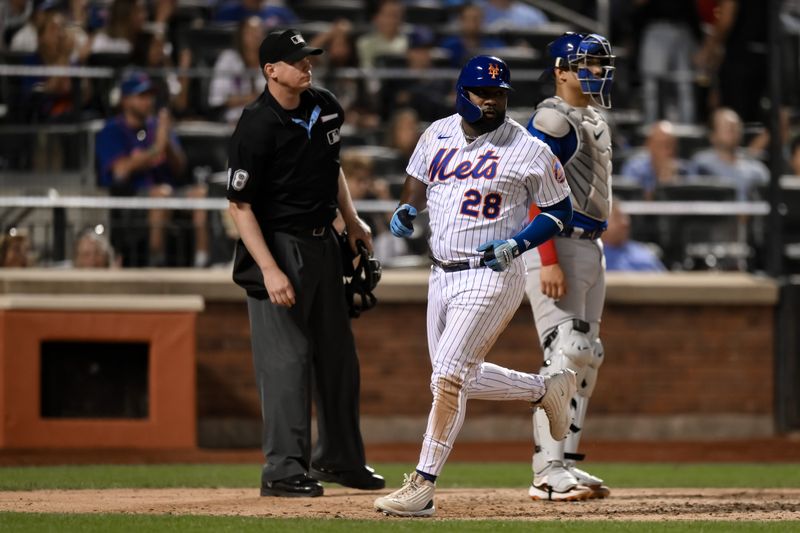 Aug 9, 2023; New York City, New York, USA; New York Mets outfielder Abraham Almonte (28) scores on a RBI single by New York Mets second baseman Jonathan Arauz (not pictured) during the sixth inning against the Chicago Cubs at Citi Field. Mandatory Credit: John Jones-USA TODAY Sports