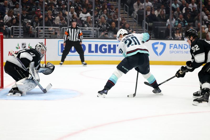 Nov 23, 2024; Los Angeles, California, USA;  Seattle Kraken right wing Eeli Tolvanen (20) shoots against Los Angeles Kings goaltender David Rittich (31) during the first period at Crypto.com Arena. Mandatory Credit: Kiyoshi Mio-Imagn Images