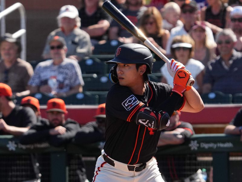 Mar 1, 2024; Scottsdale, Arizona, USA; San Francisco Giants outfielder Jung Hoo Lee (51) bats against the Texas Rangers during the first inning at Scottsdale Stadium. Mandatory Credit: Joe Camporeale-USA TODAY Sports