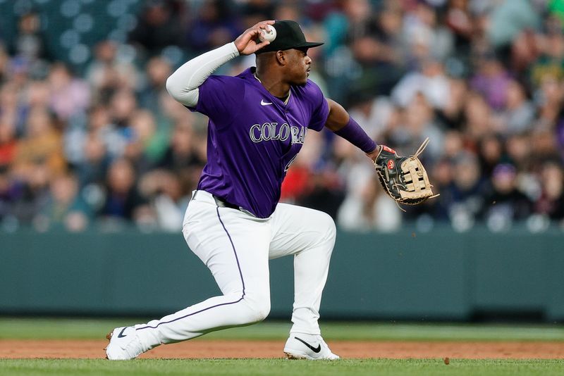 Apr 8, 2024; Denver, Colorado, USA; Colorado Rockies first baseman Elehuris Montero (44) throws to first for an out in the first inning against the Arizona Diamondbacks at Coors Field. Mandatory Credit: Isaiah J. Downing-USA TODAY Sports