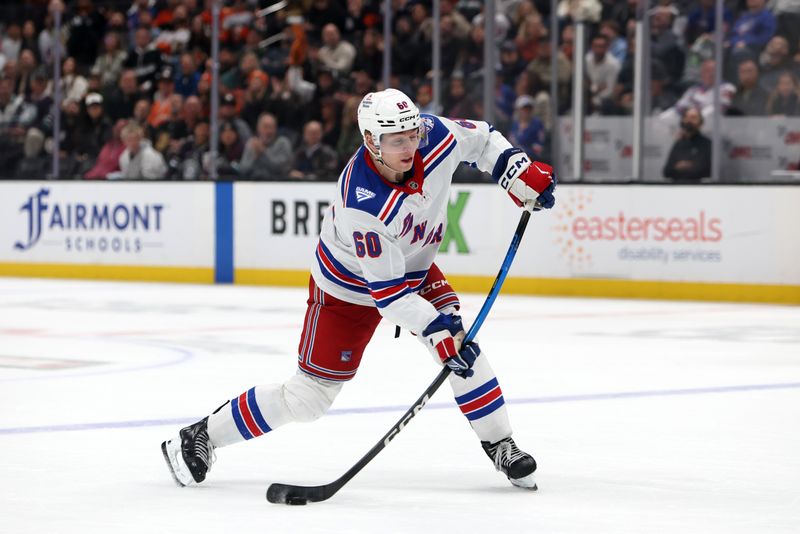 Jan 19, 2026; Anaheim, California, USA;  New York Rangers defenseman Scott Morrow (60) takes a slapshot during the third period against the Anaheim Ducks at Honda Center. Mandatory Credit: Kiyoshi Mio-Imagn Images