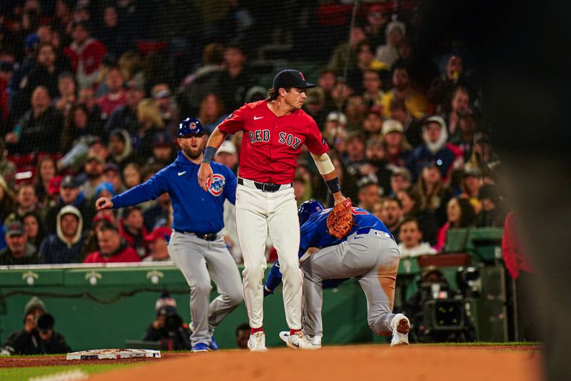 Apr 26, 2024; Boston, Massachusetts, USA; Boston Red Sox first baseman Bobby Dalbec (29) makes the out against Chicago Cubs second baseman Nico Hoerner (2) in the forth inning at Fenway Park. Mandatory Credit: David Butler II-USA TODAY Sports