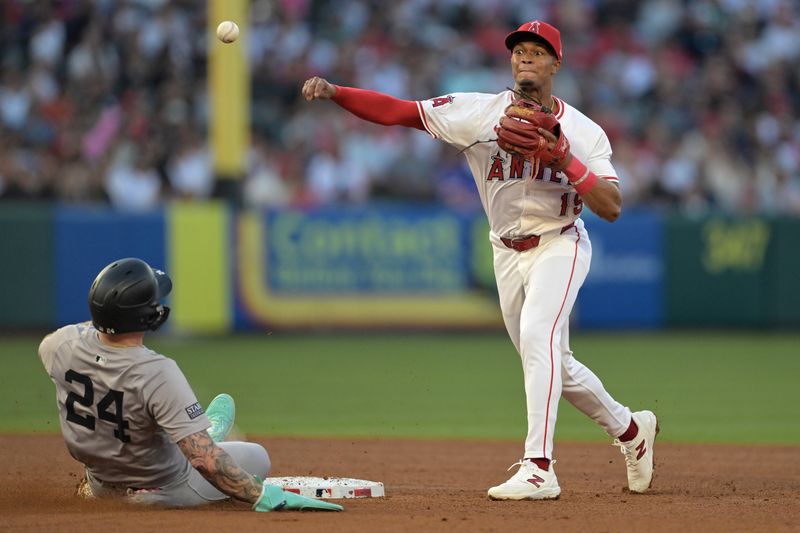 May 30, 2024; Anaheim, California, USA;  New York Yankees left fielder Alex Verdugo (24) is out at second as Los Angeles Angels second baseman Kyren Paris (19) throws to first for a double play in the fourth inning at Angel Stadium. Mandatory Credit: Jayne Kamin-Oncea-USA TODAY Sports