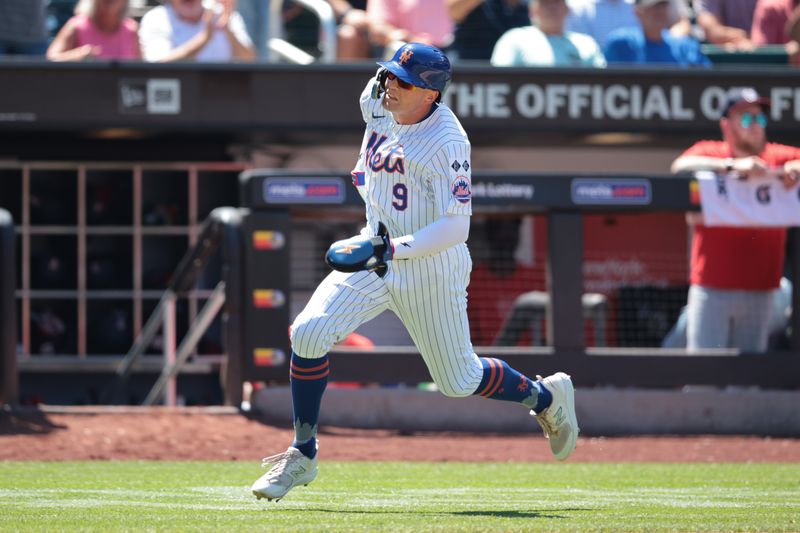 Jul 11, 2024; New York City, New York, USA; New York Mets left fielder Brandon Nimmo (9) scores a run on an RBI double by New York Mets designated hitter J.D. Martinez (not pictured) during the fifth inning against the Washington Nationals at Citi Field. Mandatory Credit: Vincent Carchietta-USA TODAY Sports