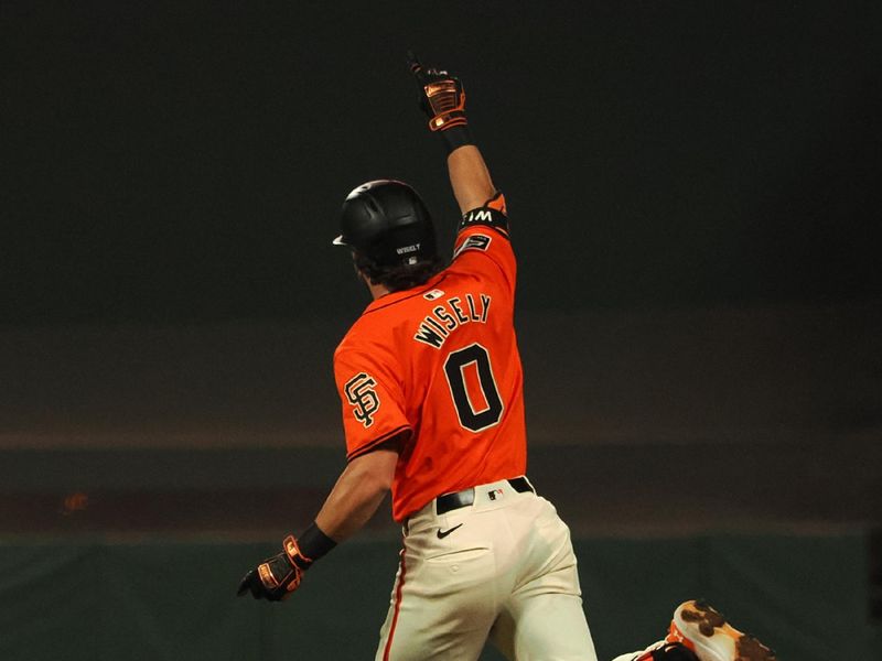 Jun 28, 2024; San Francisco, California, USA; San Francisco Giants second baseman Brett Wisely (0) celebrates as he rounds the bases on a two-run home run for a walk-off win against the Los Angeles Dodgers during the ninth inning at Oracle Park. Mandatory Credit: Kelley L Cox-USA TODAY Sports