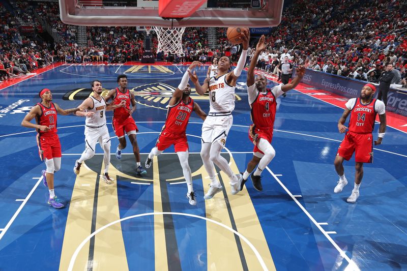 NEW ORLEANS, LA - NOVEMBER 15: Peyton Watson #8 of the Denver Nuggets drives to the basket during the game against the New Orleans Pelicans during the Emirates NBA Cup game on November 15, 2024 at the Smoothie King Center in New Orleans, Louisiana. NOTE TO USER: User expressly acknowledges and agrees that, by downloading and or using this Photograph, user is consenting to the terms and conditions of the Getty Images License Agreement. Mandatory Copyright Notice: Copyright 2024 NBAE (Photo by Layne Murdoch Jr./NBAE via Getty Images)