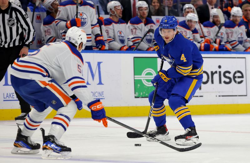 Mar 9, 2024; Buffalo, New York, USA;  Buffalo Sabres defenseman Bowen Byram (4) carries the puck up ice during the second period against the Edmonton Oilers at KeyBank Center. Mandatory Credit: Timothy T. Ludwig-USA TODAY Sports