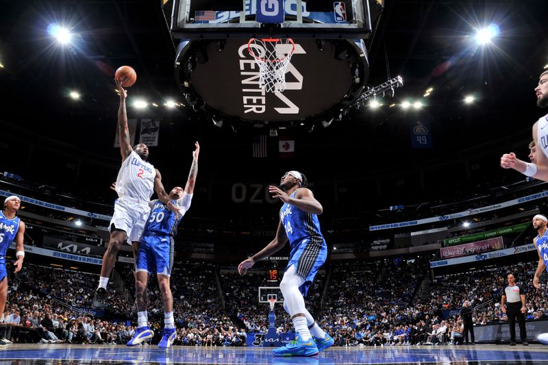 ORLANDO, FL - MARCH 29: Kawhi Leonard #2 of the LA Clippers drives to the basket during the game against the Orlando Magic on March 29, 2024 at the Kia Center in Orlando, Florida. NOTE TO USER: User expressly acknowledges and agrees that, by downloading and or using this photograph, User is consenting to the terms and conditions of the Getty Images License Agreement. Mandatory Copyright Notice: Copyright 2024 NBAE (Photo by Fernando Medina/NBAE via Getty Images)