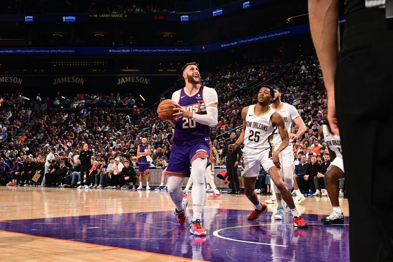 PHOENIX, AZ - APRIL 7: Jusuf Nurkic #20 of the Phoenix Suns handles the ball during the game against the New Orleans Pelicans on April 7, 2024 at Footprint Center in Phoenix, Arizona. NOTE TO USER: User expressly acknowledges and agrees that, by downloading and or using this photograph, user is consenting to the terms and conditions of the Getty Images License Agreement. Mandatory Copyright Notice: Copyright 2024 NBAE (Photo by Kate Frese/NBAE via Getty Images)