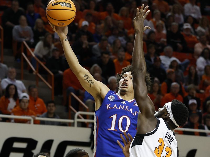 Feb 14, 2023; Stillwater, Oklahoma, USA; Kansas Jayhawks forward Jalen Wilson (10) shoots against Oklahoma State Cowboys forward Moussa Cisse (33) during the second half at Gallagher-Iba Arena. Kansas won 87-76. Mandatory Credit: Alonzo Adams-USA TODAY Sports