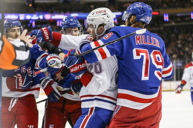 Feb 15, 2024; New York, New York, USA; New York Rangers defenseman K'Andre Miller (79) grabs Montreal Canadiens left wing Juraj Slafkovsky (20) during a scuffle in the first period at Madison Square Garden. Mandatory Credit: Wendell Cruz-USA TODAY Sports