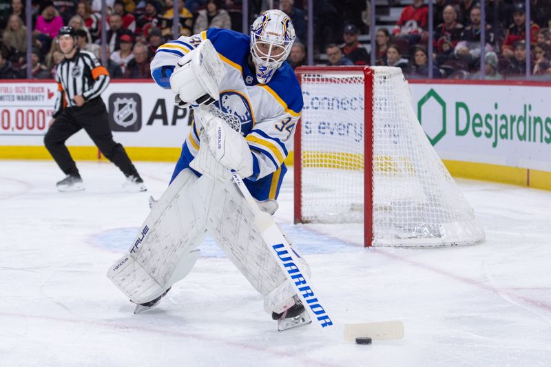 Dec 23, 2025; Ottawa, Ontario, CAN; Buffalo Sabres goalie Alex Lyon (34) clears the puck in the first period against the Ottawa Senators at the Canadian Tire Centre. Mandatory Credit: Marc DesRosiers-IMAGN Images