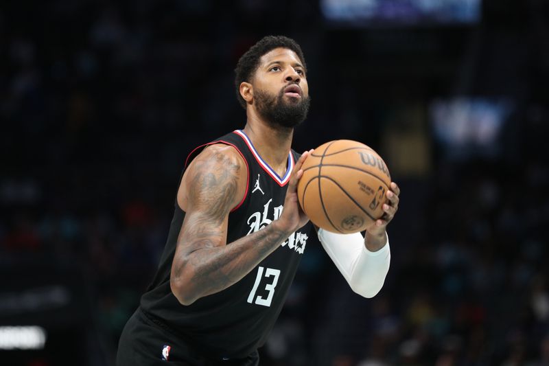 CHARLOTTE, NC - MARCH 31: Paul George #13 of the LA Clippers shoots a free throw during the game against the Charlotte Hornets on March 31, 2024 at Spectrum Center in Charlotte, North Carolina. NOTE TO USER: User expressly acknowledges and agrees that, by downloading and or using this photograph, User is consenting to the terms and conditions of the Getty Images License Agreement.  Mandatory Copyright Notice:  Copyright 2024 NBAE (Photo by Brock Williams-Smith/NBAE via Getty Images)