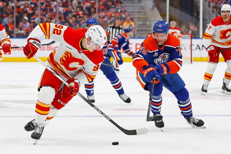 Oct 8, 2025; Edmonton, Alberta, CAN; Calgary Flames defensemen Maceo Phillips (92) looks to make a pass in front of Edmonton Oilers defensemen Alec Regula (75) during the second period at Rogers Place. Mandatory Credit: Perry Nelson-Imagn Images