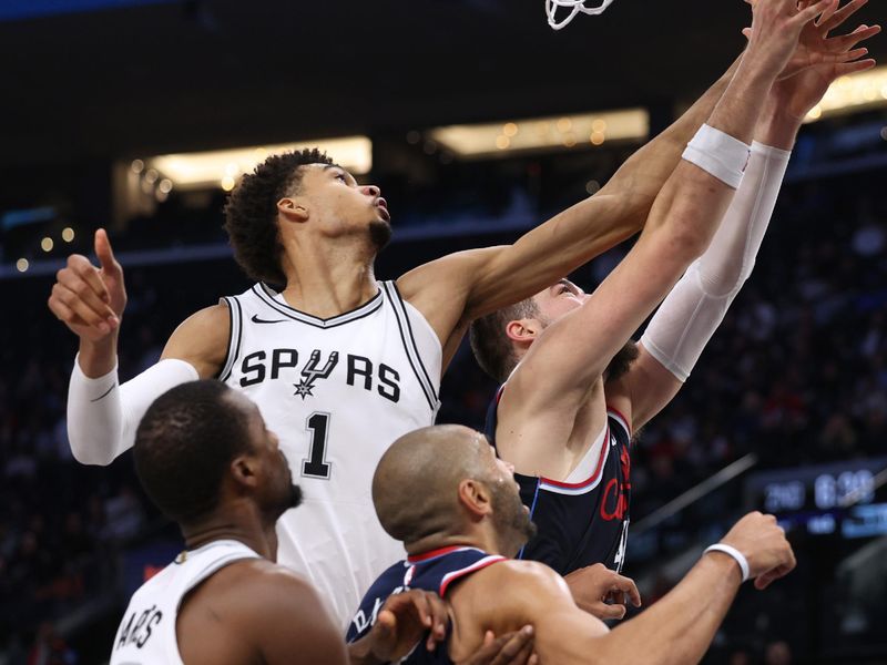 INGLEWOOD, CALIFORNIA - NOVEMBER 04: Ivica Zubac #40 of the LA Clippers has his shot blocked by Victor Wembanyama #1 of the San Antonio Spurs during the first half at Intuit Dome on November 04, 2024 in Inglewood, California. (Photo by Harry How/Getty Images)