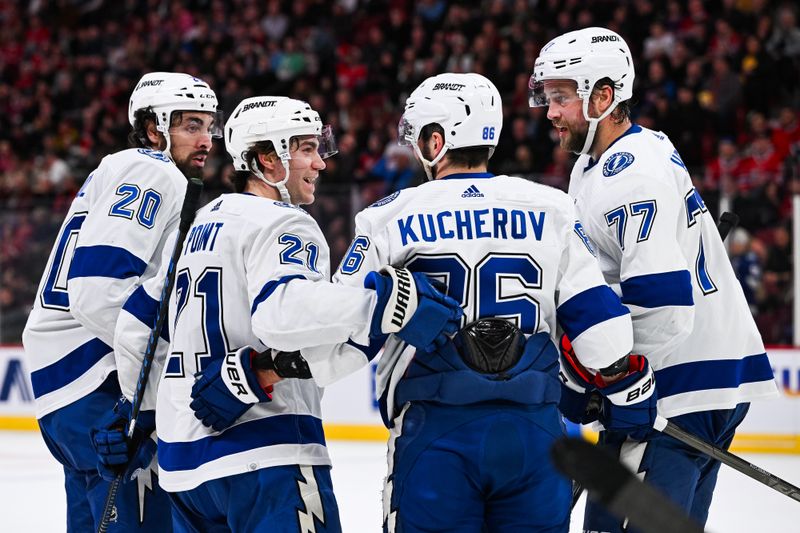 Apr 4, 2024; Montreal, Quebec, CAN; Tampa Bay Lightning right wing Nikita Kucherov (86) celebrates his goal against the Montreal Canadiens with center Brayden Point (21) during the second period at Bell Centre. Mandatory Credit: David Kirouac-USA TODAY Sports