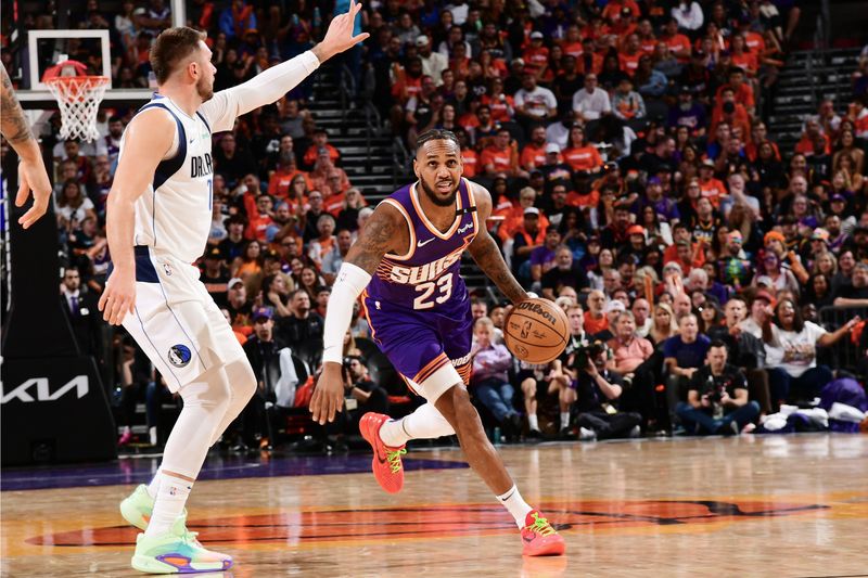 PHOENIX, AZ - OCTOBER  26: Monte Morris #23 of the Phoenix Suns dribbles the ball during the game against the Dallas Mavericks on October 26, 2024 at Footprint Center in Phoenix, Arizona. NOTE TO USER: User expressly acknowledges and agrees that, by downloading and or using this photograph, user is consenting to the terms and conditions of the Getty Images License Agreement. Mandatory Copyright Notice: Copyright 2024 NBAE (Photo by Kate Frese/NBAE via Getty Images)