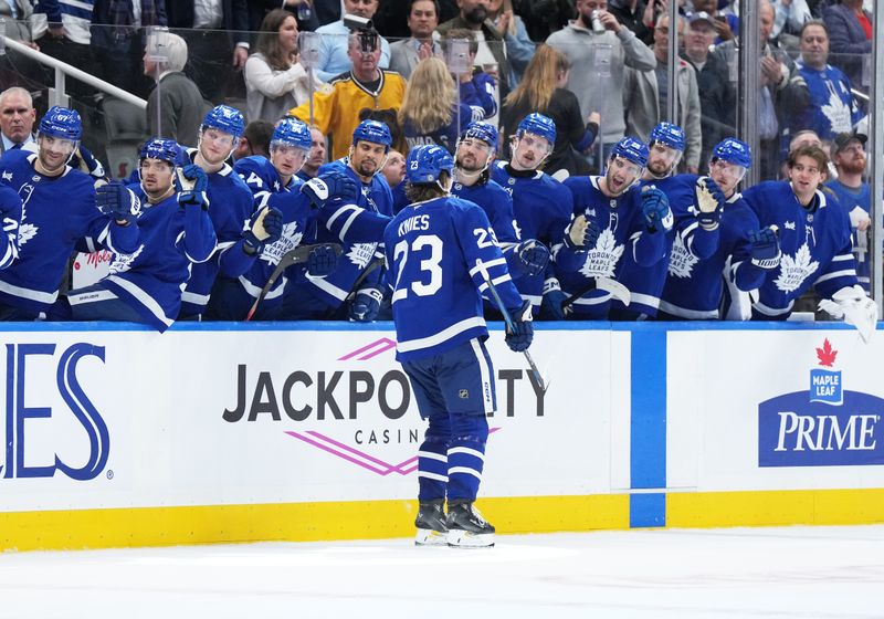 Nov 5, 2024; Toronto, Ontario, CAN; Toronto Maple Leafs left wing Matthew Knies (23) celebrates at the bench after scoring a goal against the Boston Bruins during the third period at Scotiabank Arena. Mandatory Credit: Nick Turchiaro-Imagn Imagess