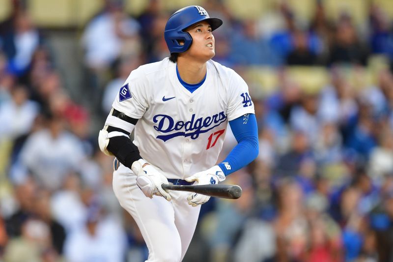 May 4, 2024; Los Angeles, California, USA; Los Angeles Dodgers designated hitter Shohei Ohtani (17) hits a solo home run against the Atlanta Braves during the third inning at Dodger Stadium. Mandatory Credit: Gary A. Vasquez-USA TODAY Sports