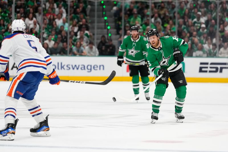 May 31, 2024; Dallas, Texas, USA; Dallas Stars center Sam Steel (18) passes the puck against Edmonton Oilers defenseman Cody Ceci (5) during the second period between the Dallas Stars and the Edmonton Oilers in game five of the Western Conference Final of the 2024 Stanley Cup Playoffs at American Airlines Center. Mandatory Credit: Chris Jones-USA TODAY Sports