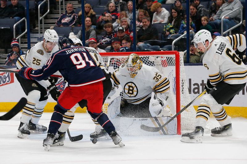 Jan 2, 2024; Columbus, Ohio, USA; Columbus Blue Jackets left wing Kent Johnson (91) looks for a rebound of a Boston Bruins goalie Linus Ullmark (35) save during the third period at Nationwide Arena. Mandatory Credit: Russell LaBounty-USA TODAY Sports