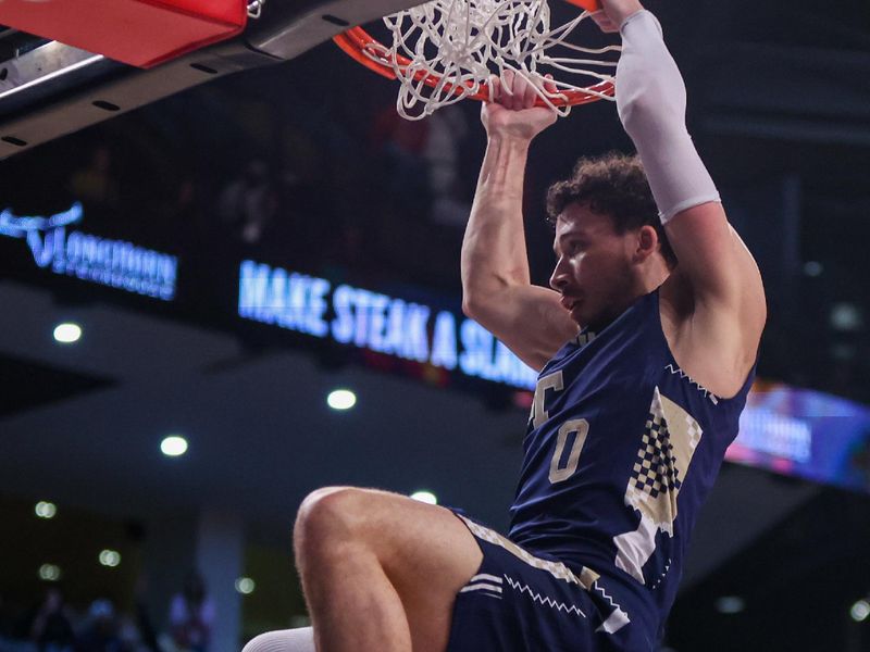 Feb 1, 2025; Atlanta, Georgia, USA; Georgia Tech Yellow Jackets guard Lance Terry (0) dunks against the Louisville Cardinals in the second half at McCamish Pavilion. Mandatory Credit: Brett Davis-Imagn Images