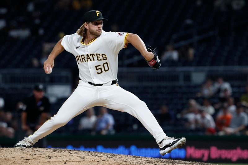 May 21, 2024; Pittsburgh, Pennsylvania, USA;  Pittsburgh Pirates relief pitcher Carmen Mlodzinski (50) pitches against the San Francisco Giants during the ninth inning at PNC Park. Mandatory Credit: Charles LeClaire-USA TODAY Sports